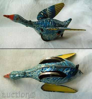 Old toy tin metal duck with key