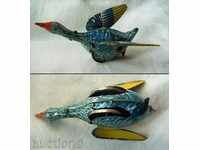 I am selling an old metal duck toy with a key