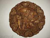 an old wall plate with fine carving in perfect quality