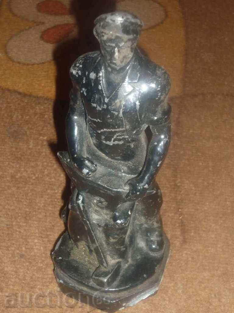 An ancient statuette probably from a tin-alloy alloy