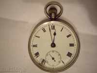 Old silver pocket watch.