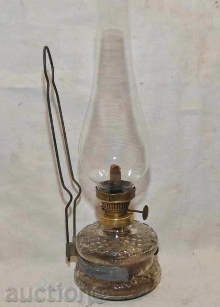 A small wall lamp with a glass bottle