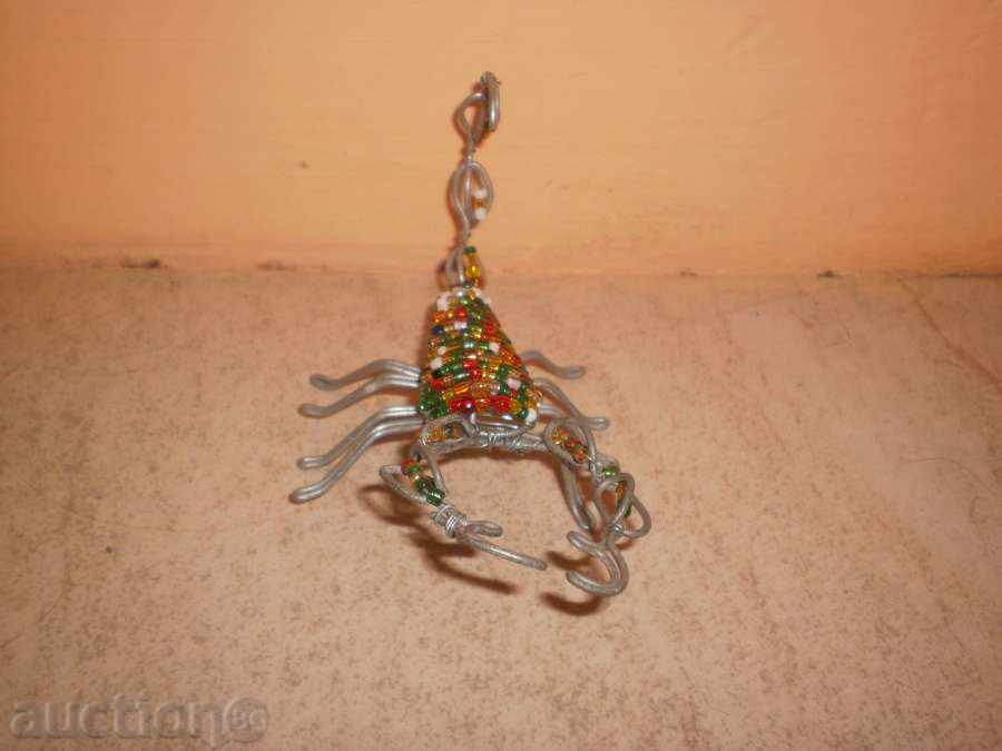 Scorpio-small figure of wire and sand beads with price 25.00 BGN | € 12.78 Scorpio-small figure of wire and sand beads with price 25.00 BGN | € 12.78