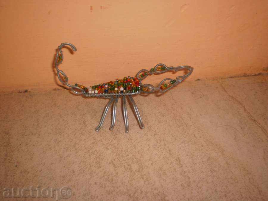Auction Scorpio-small figure of wire and sand beads Auction Scorpio-small figure of wire and sand beads