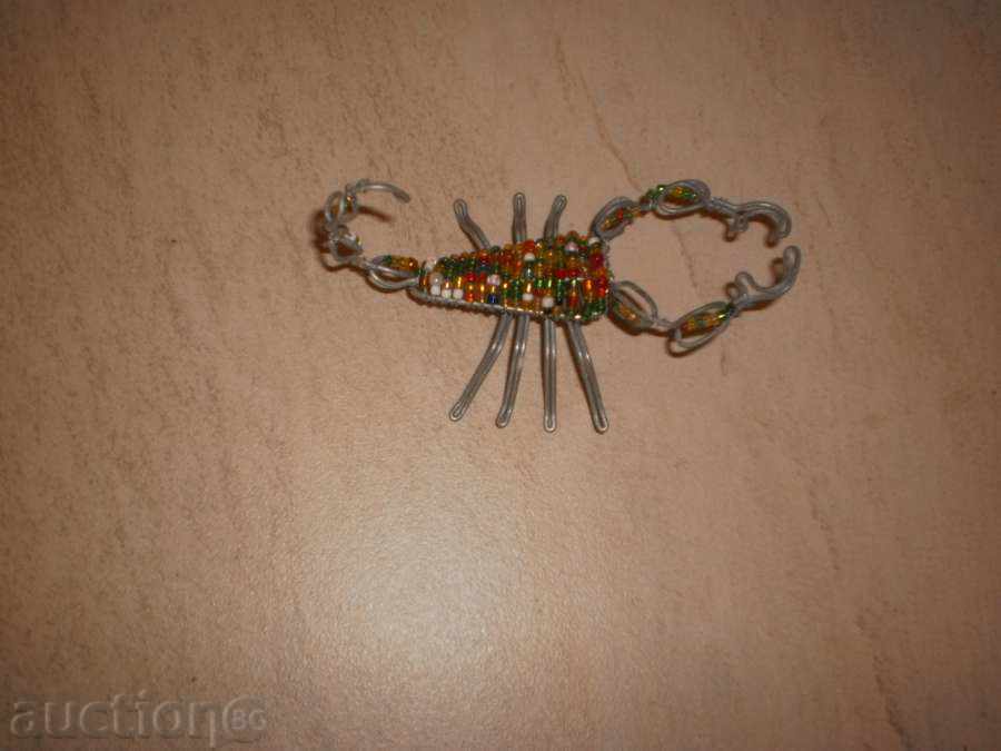 Delivery of Scorpio-small figure of wire and sand beads Delivery of Scorpio-small figure of wire and sand beads