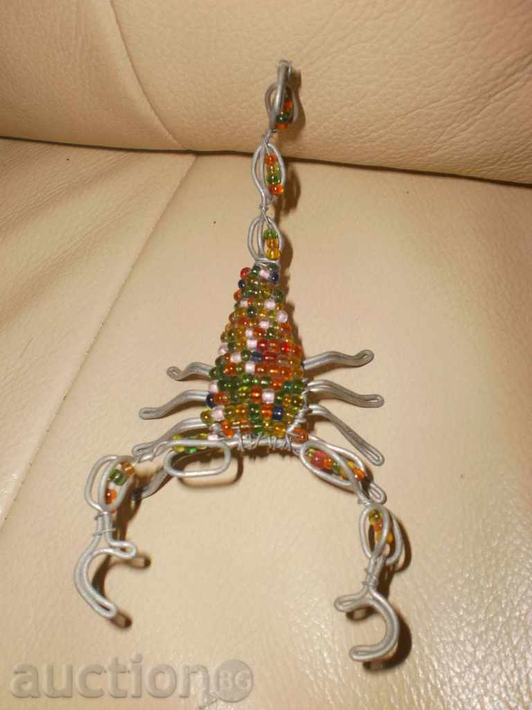 Scorpio-small figure of wire and sand beads