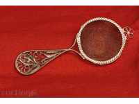 Sieve with handle with filigree