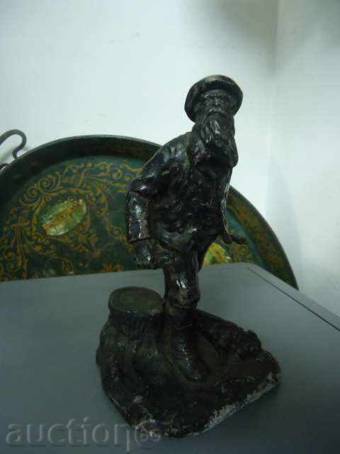 Beautiful metal statuette of a hunter with a dog