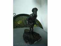 Beautiful metal statuette of a hunter with a dog