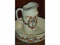 An ancient porcelain jug with a basin for washing the end of the 19th century