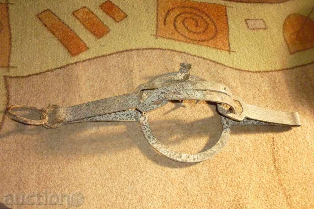 An antique hand forged trap