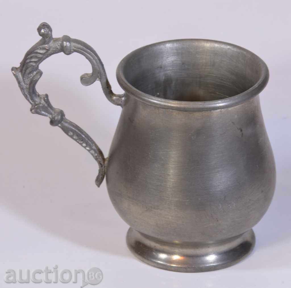 Decorative small zinc jug