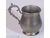 Decorative small zinc jug