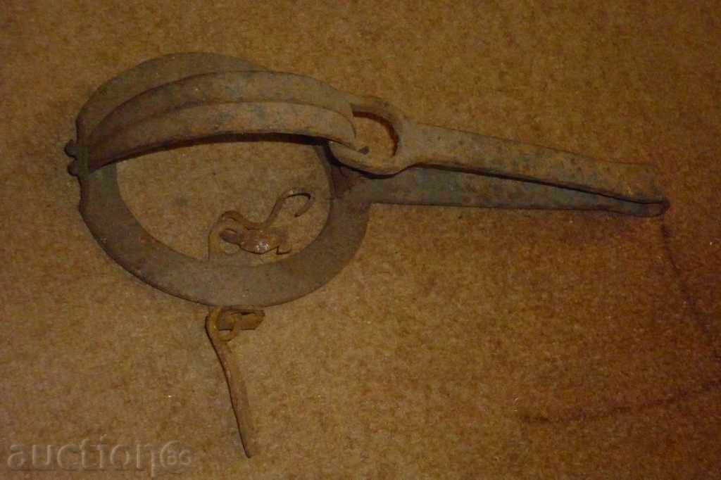 An antique hand forged trap