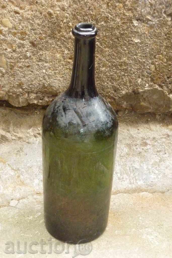 An old-fashioned bottle, a bottle of wine