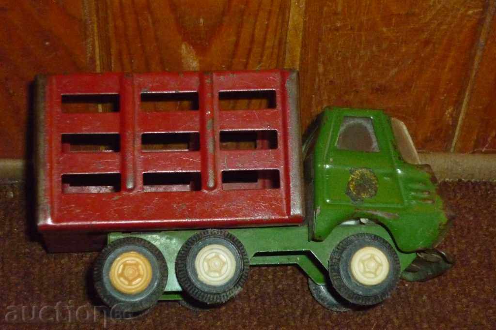 Auction Soc. a toy truck, a cart, a car, a truck Auction Soc. a toy truck, a cart, a car, a truck