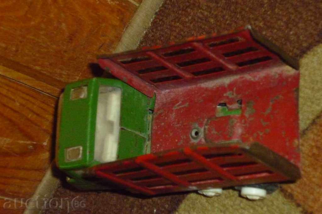 Delivery of Soc. a toy truck, a cart, a car, a truck Delivery of Soc. a toy truck, a cart, a car, a truck