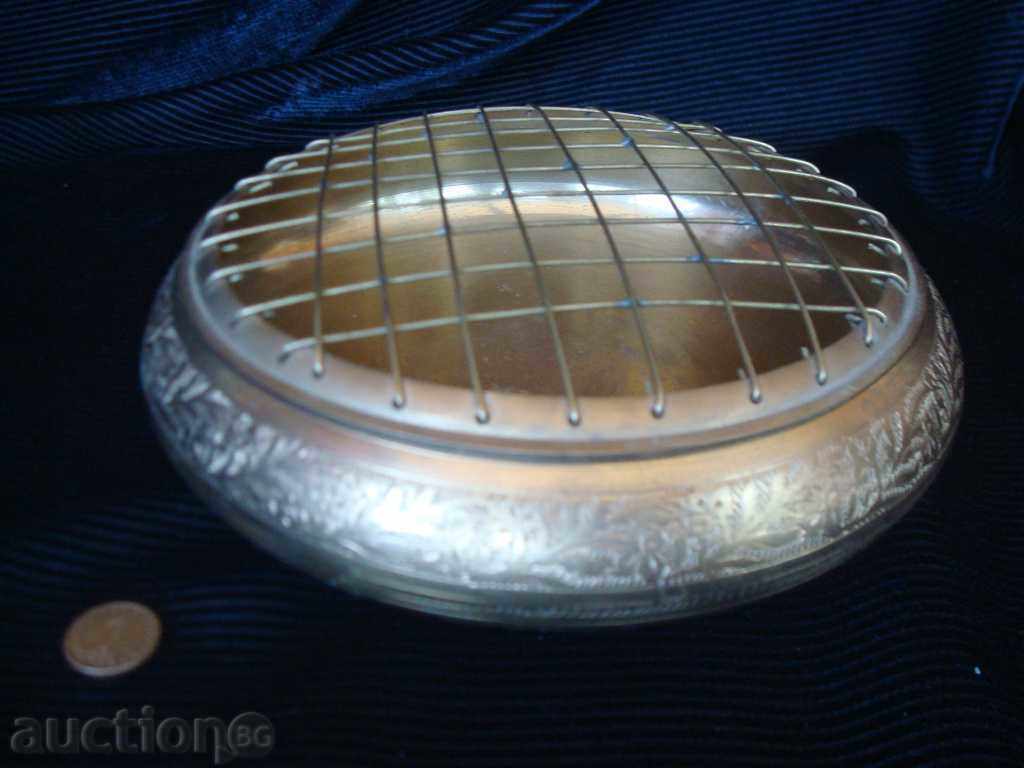 Massive ashtray for cigars made of metal-engraved bronze.