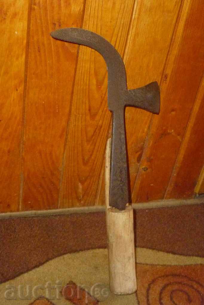 An old hand forged hammer, wrought iron, a chopper, a knife