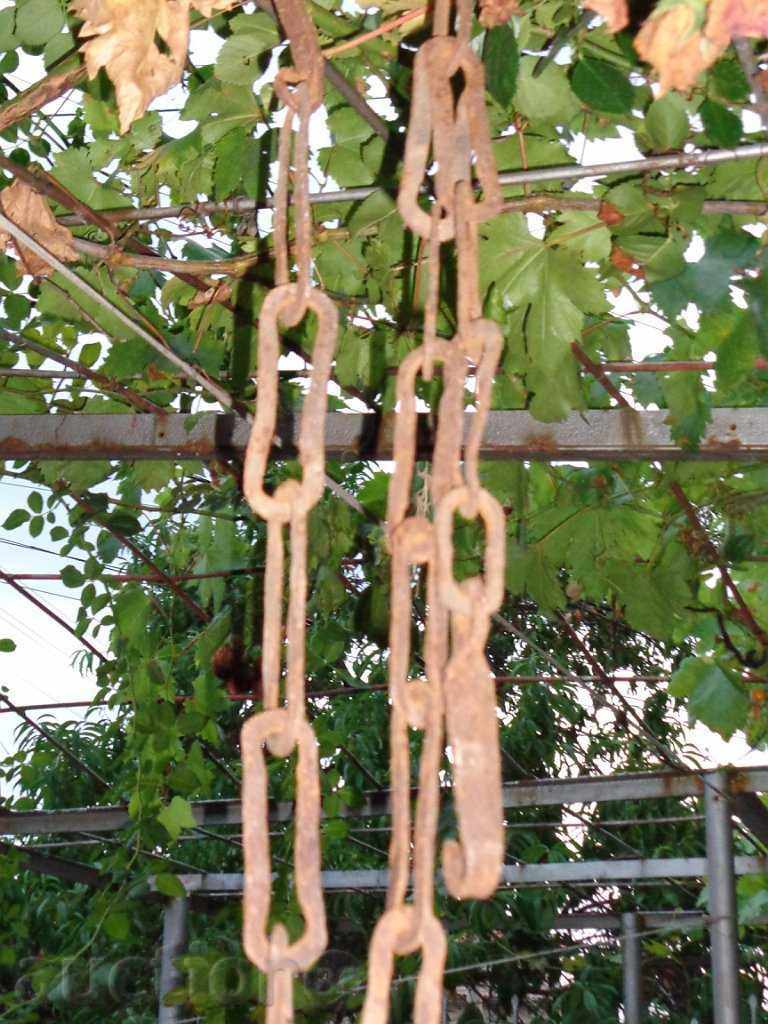 Auction An old forged chain, wrought iron, a singer for a hearth Auction An old forged chain, wrought iron, a singer for a hearth