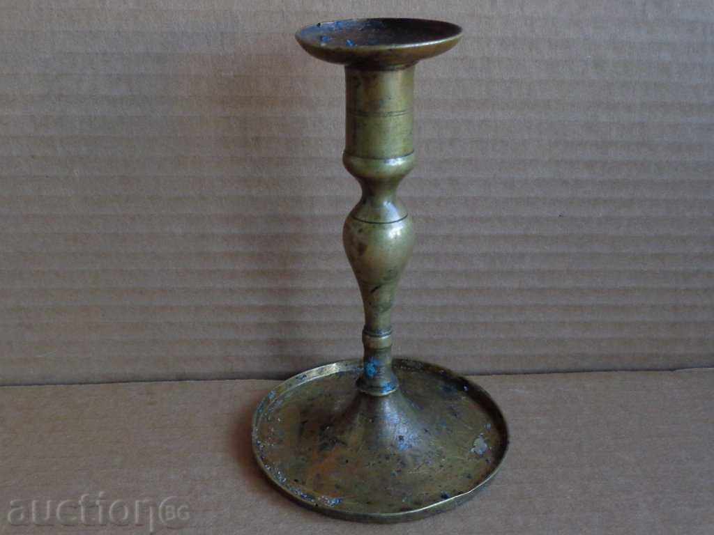 Delivery of An old brass candlestick