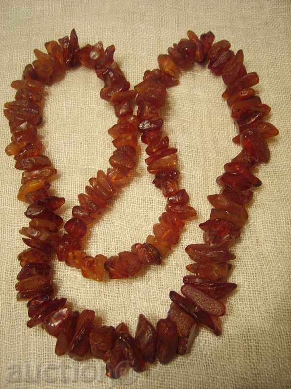 I sell a red amber necklace of untreated pieces with price 320.00 BGN | € 163.61