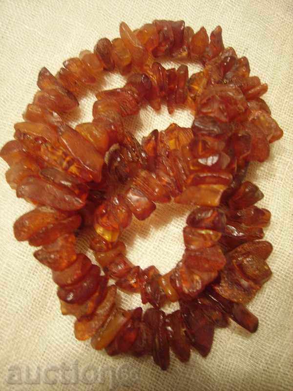 Auction  I sell a red amber necklace of untreated pieces