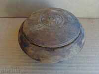 An old wooden bowl, a salt pan, a sugar bowl, a bowl
