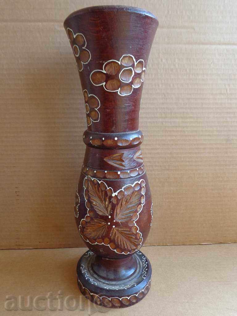 Old wooden vase for dry flowers