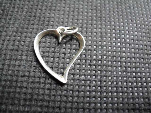 Beautiful silver medallion heart with price 10.00 BGN | € 5.11 Beautiful silver medallion heart with price 10.00 BGN | € 5.11