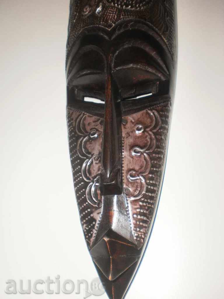 African mask of ebony and copper-5 + - 5