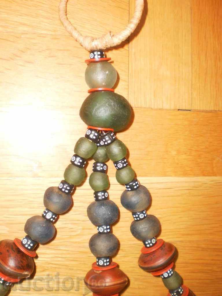 Auction  Wall decoration with ceramics and exotic seeds from Africa-2