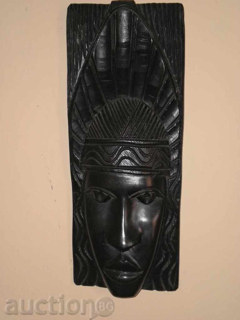 African mask of monolithic ebony wood