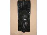 African mask of monolithic ebony wood