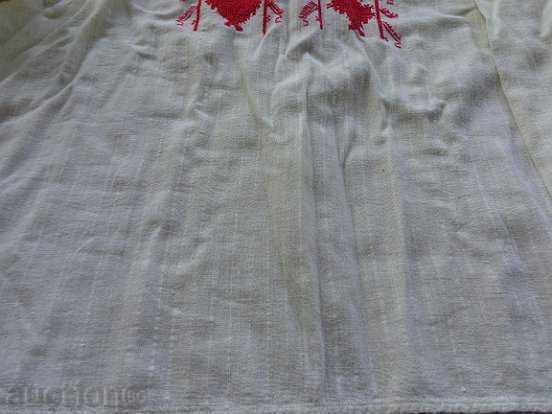 Delivery of An old embroidered shirt from a costume for a boy in the early twentieth century