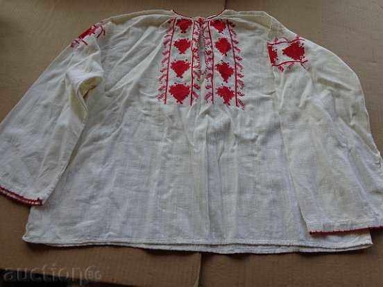 An old embroidered shirt from a costume for a boy in the early twentieth century