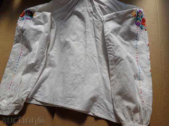 Delivery of An old embroidered shirt from a costume for a boy in the early twentieth century