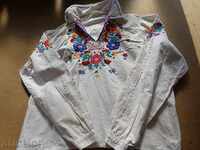 An old embroidered shirt from a costume for a boy in the early twentieth century