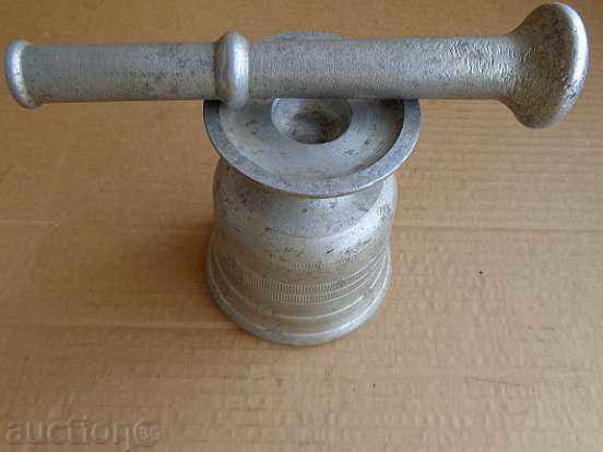 Delivery of Old white metal mortar, pestle, mortar Delivery of Old white metal mortar, pestle, mortar