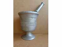 Old white metal mortar, pestle, mortar