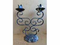 Old forged candlestick, candle