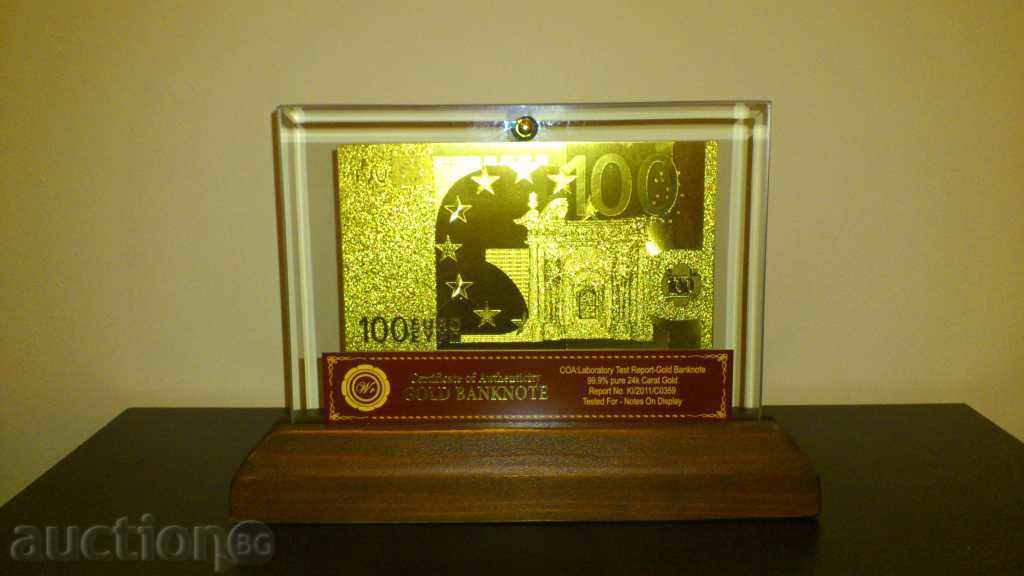 Delivery of 100euro golden banknote in a glass stand and solid wood Delivery of 100euro golden banknote in a glass stand and solid wood