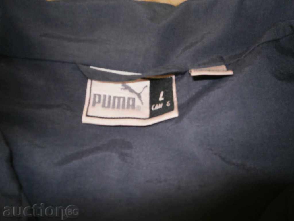 Dark blue Puma windbreaker, size L with price 25.00 BGN | € 12.78 Dark blue Puma windbreaker, size L with price 25.00 BGN | € 12.78