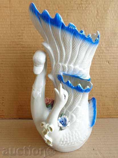 An old porcelain vase with swans, porcelain