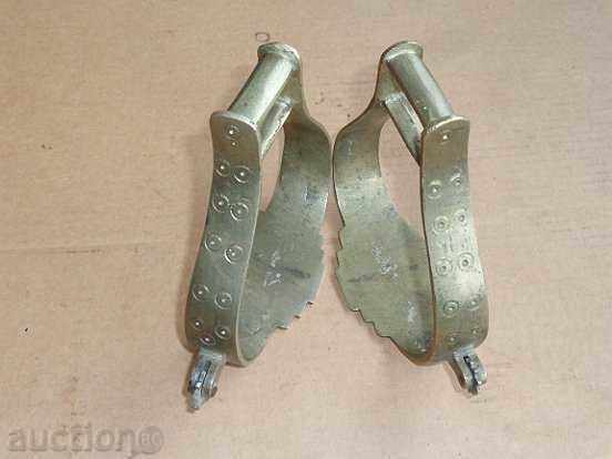 Old bronze stirrups with spurs, cavalry, saddle