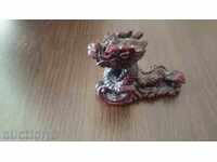 Dragon (without the "e" at the end, as it's a neuter noun in Romanian)