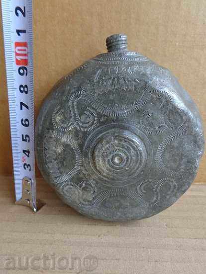 Delivery of An old caella-molar pavement, a sprig, a bottle, a flask Delivery of An old caella-molar pavement, a sprig, a bottle, a flask