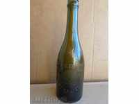 An old beer bottle, a bottle, a glass, a tamarind
