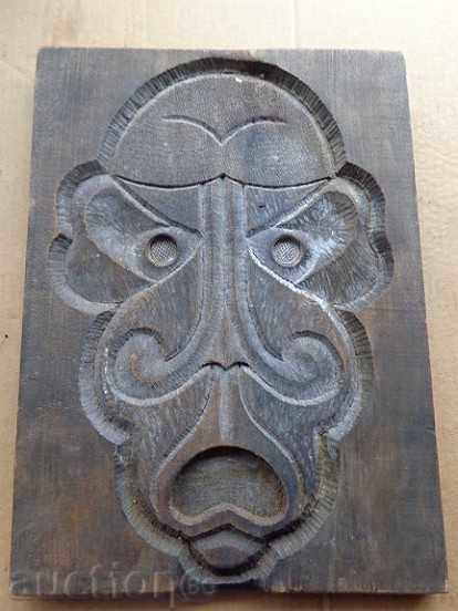Old wooden panel, wood mask, carving