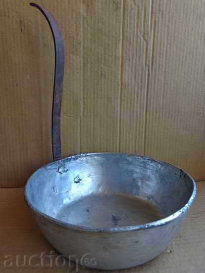 A copper pan, a copper pot, a baker